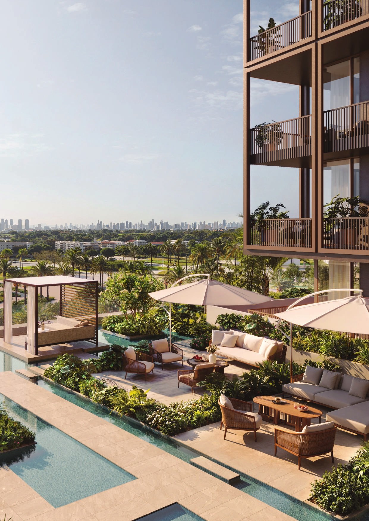 The landscaped pool deck with cabanas and umbrellas