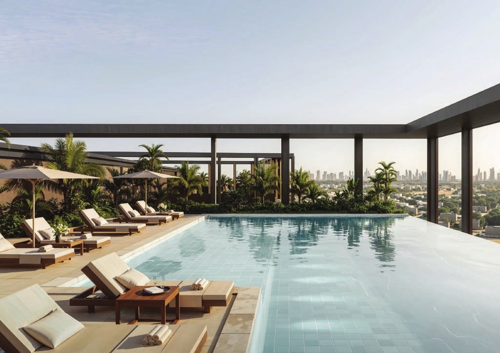 The rooftop pool, loungers and pergola above the city