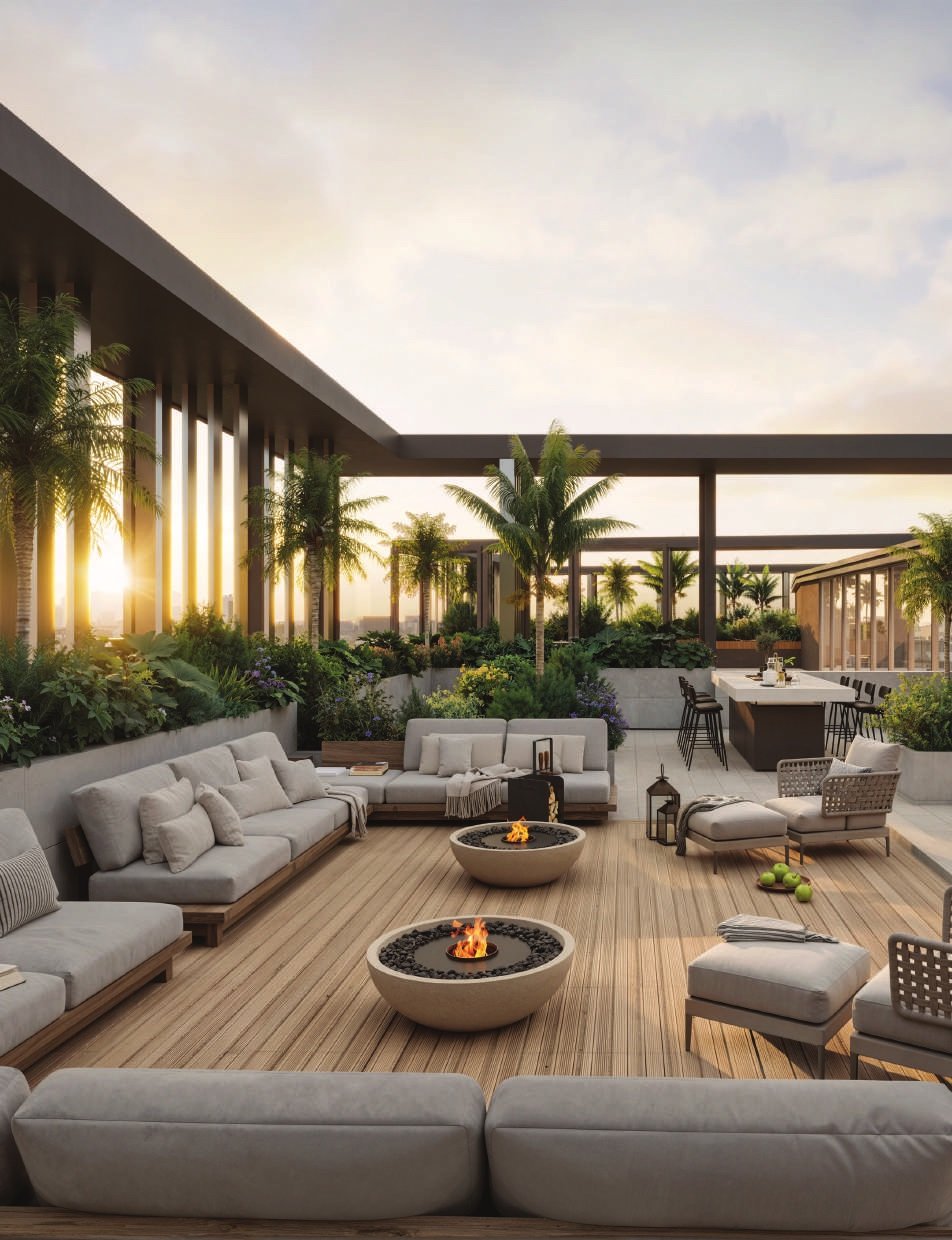The rooftop terrace at sunset: sofas, firepits and a timber deck